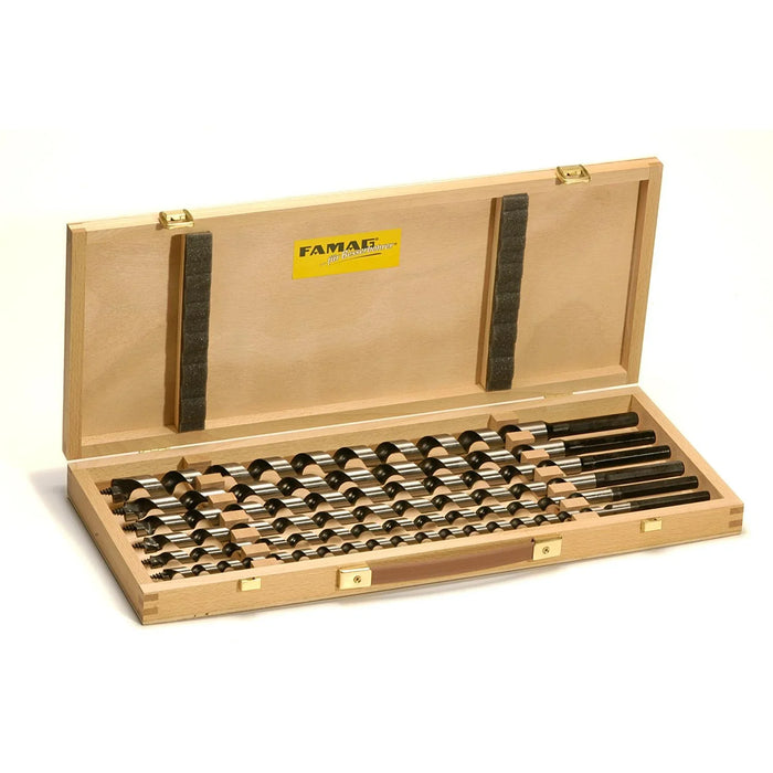 Set of drill bits in a wooden case with Fama tool brand visible