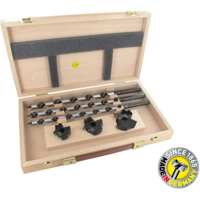 Wooden box containing 3 drill bits and countersink with a visible brand logo.