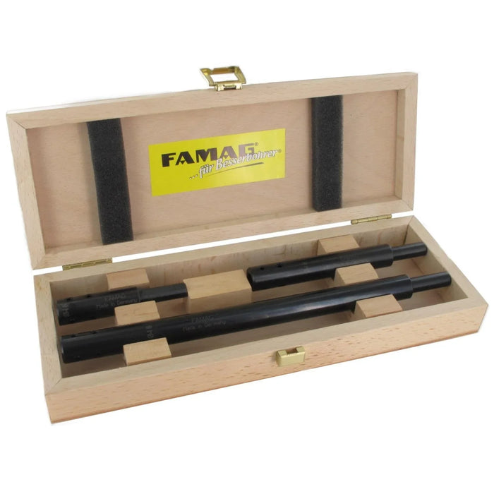 Wooden tool case with black tools and FAMAG logo on a white background