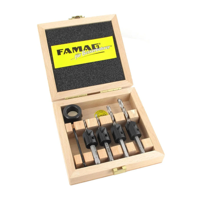 Set of 4 drill bits with countersinks and depth adjustment ring in a wooden box with Fama brand logo on a white background