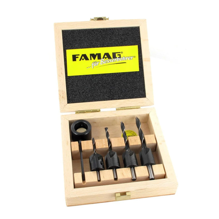 Set of 4 drill bits with countersinks and a depth adjustment ring in a wooden box with FAMAG logo on a white background