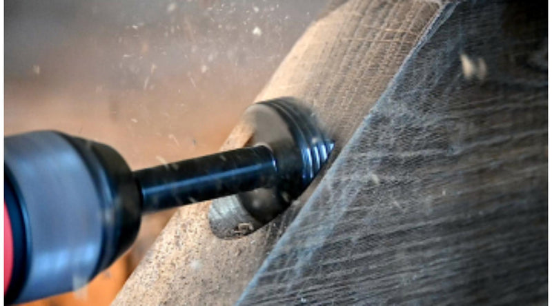 Close-up of a Bormax bit drilling a hole in a piece of wood 