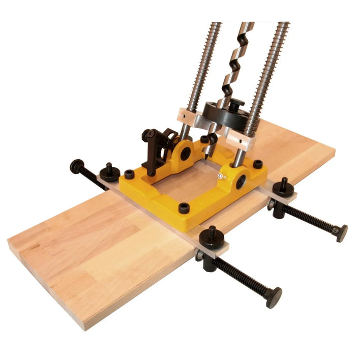 base of drill stand secured to a plank of wood using extension rails and clamps