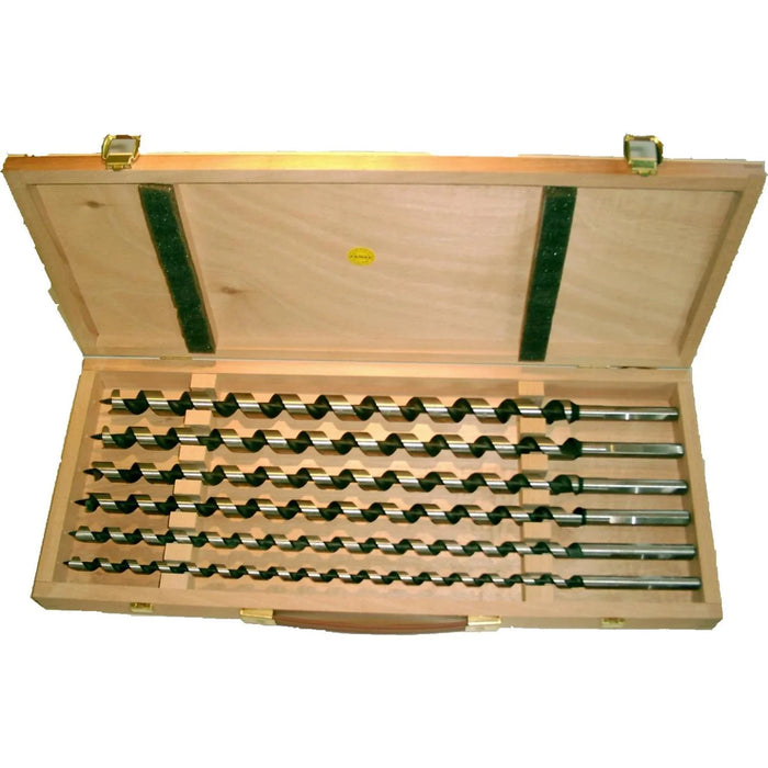 Set of Auger bits in a wooden case on a white background