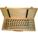 Set of Auger bits in a wooden case on a white background