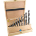 Set of 11 drill bits in a wooden box on a white background