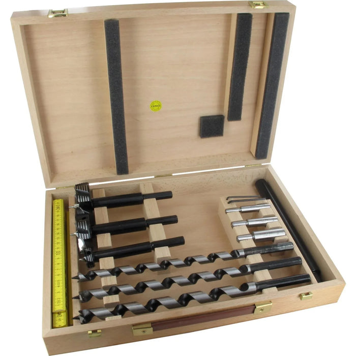 Wooden drill bit set with various drill bits and a ruler inside an open wooden box.