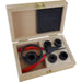 Wooden box with tools including a red and black pliers, and 5 black cylindrical depth stops on a white background.