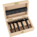Set of 5 black forstner bits in a wooden box on a white background