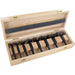 Set of 8 black forstner bits in a wooden box on a white background