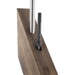 Wooden surface rod inserted into hole with second hole being drilled