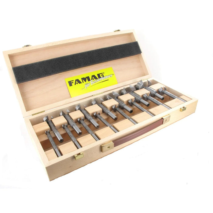 Set of 15 Forstner bits in a wooden box with FAMAG branding on a white background