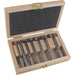 Set of drill bits in a wooden case on a white background