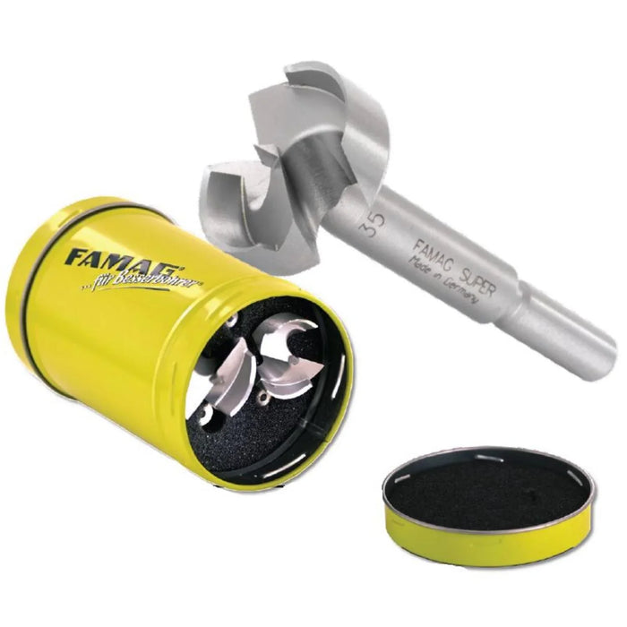 FAMAG drill bit set in a yellow Famag branded circular tin case on a white background