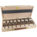 Set of 15 Artificial drill bits in a wooden case on a white background