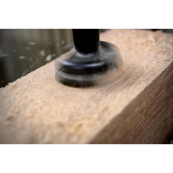 Wooden surface being large hole being drilled into it