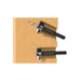 Two black tools on a wooden surface with a white background
