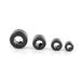 Set of four black metal rings of different sizes on a white background