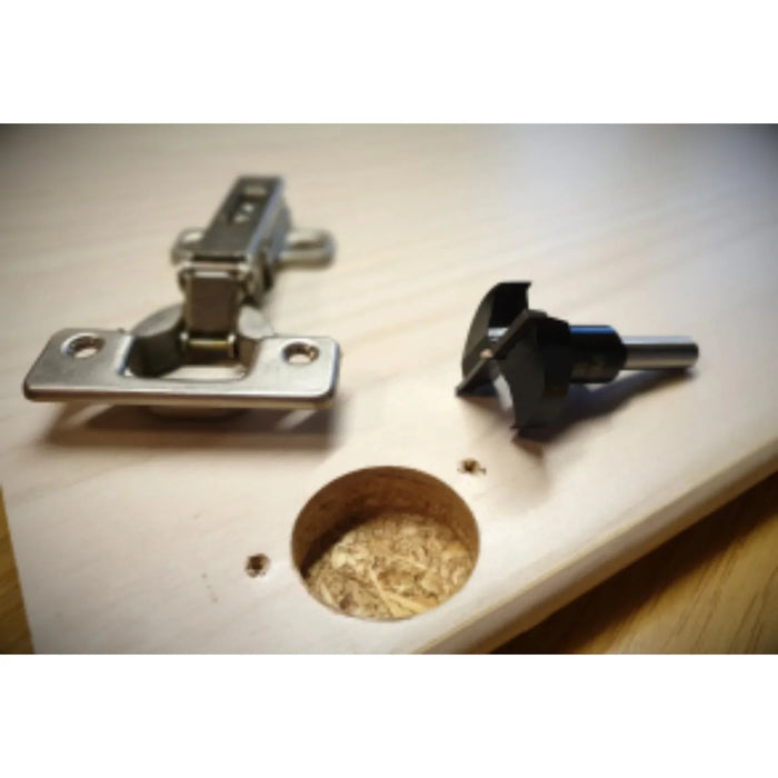 reverse of cupboiard door with hole prepared to insert the hinge