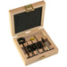 Set of drill bits and countersinks in a wooden box on a white background