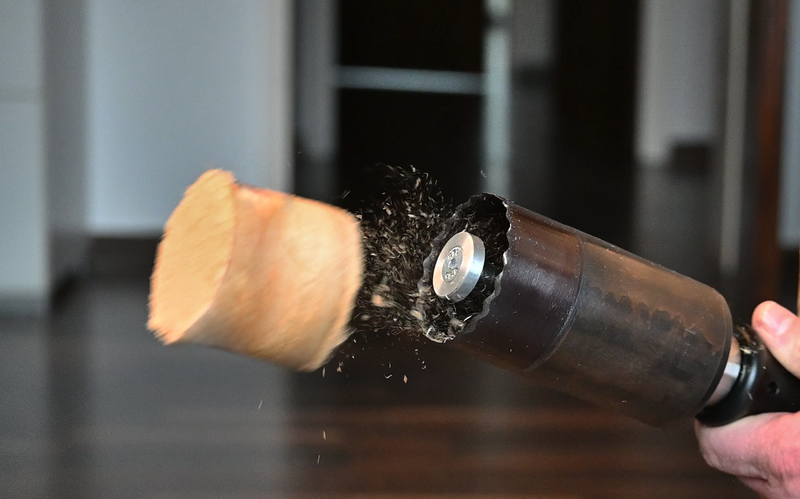 wood core being ejected from a hole saw